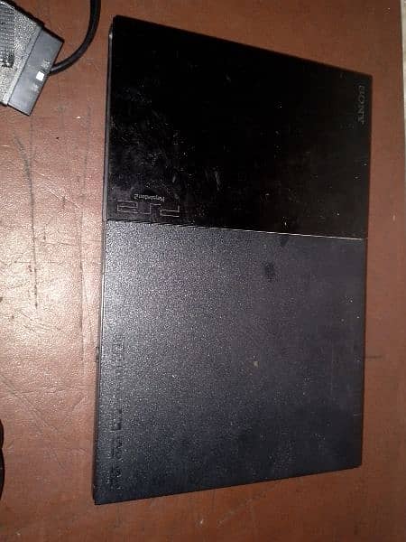 PS2 console+AV cable+ power cable+2 controller 6