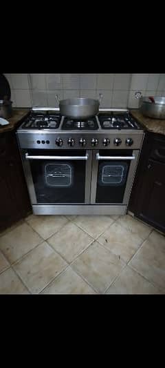 corona 5 burner gas stove with grill and oven.