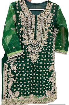 Emerald Green organza heavily embellished with nakshi and dabka work.