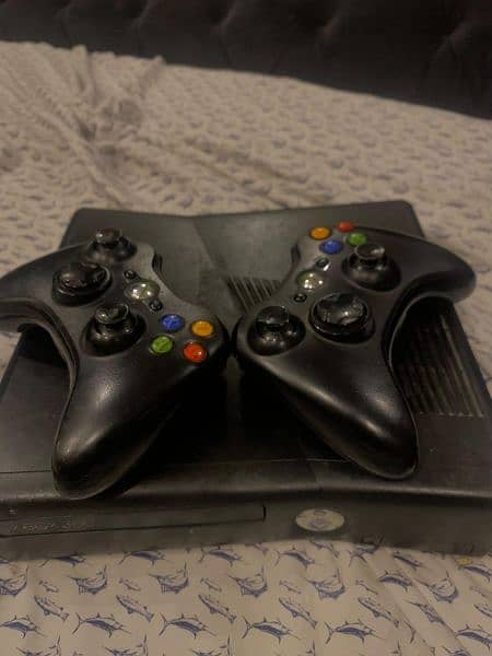 Xbox 360 with 2 controllers and with plenty of games downloaded 0