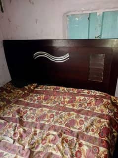 one bed with side table for sale condition use but not that much