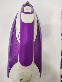 Steam iron in purple and white colour