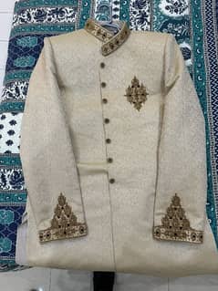 sherwani ivory colour with red stones