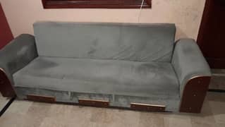 sofa cum bed with table is available for sell