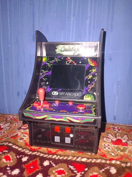 GALAGA GAME CELL OR CHARGER SE BH CHALTA HA ACHI CONDITION MAIN HA 11