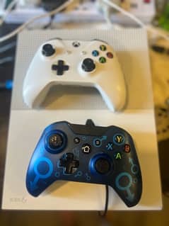 Xbox one s 500gb with original controller and a wired controller