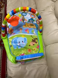baby playing gym mat with music