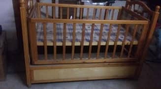 Big size wooden cot with a separate wooden swing