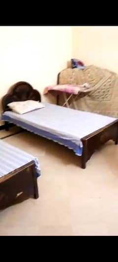 2 single wooden bed used