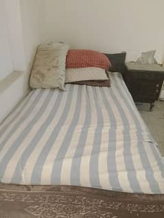 Bed with side table