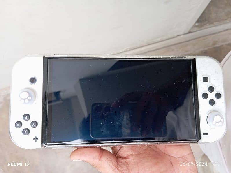 sell my Nintendo switch OLED with 256gb+64gb full game load 13