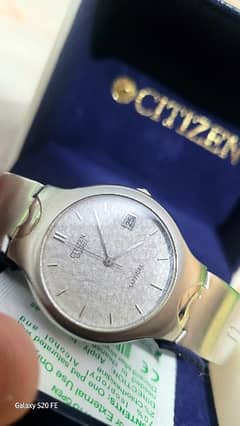 Citizen Quartz Sapphire Watch which has a golden machinery.