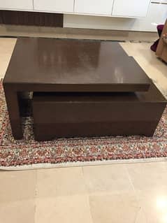 Wooden center table with drawer