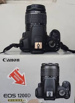 Canon EOS 1200d with extra lens and flash gun