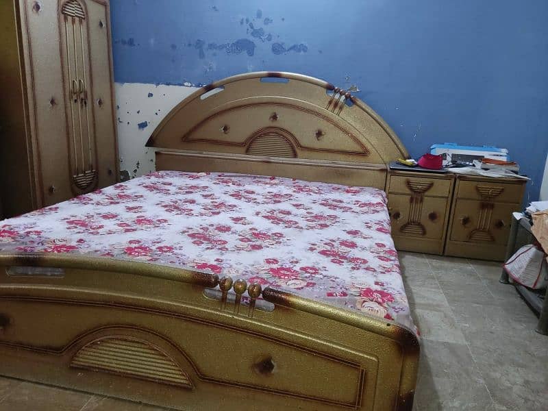 king size bed and two side tables 1