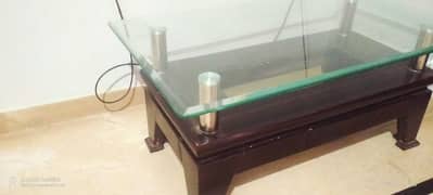 wooden center table with glass top