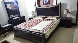 queen size bed. side tables. dressing table