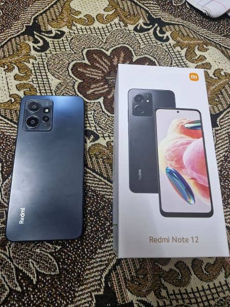 Redmi note 12 with box and charger 1