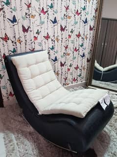 black rocking chair with cushion