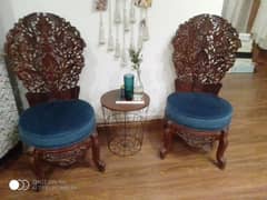 chinoti carved chairs.