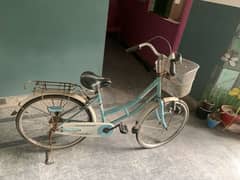 Teal bicycle with basket