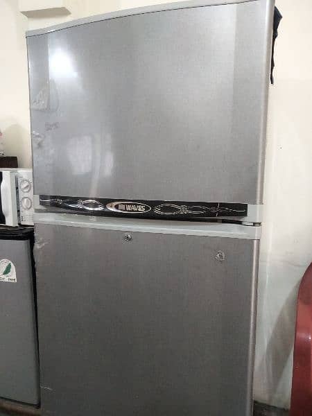 Waves almost new.  neat and clean full size jumbo fridge. 13