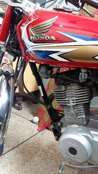 Red Honda 125 lush condition 5