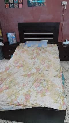 laminated wooden bed . single with mattress