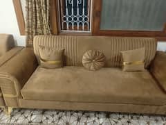 Elegant Beige Sofa with Golden Accents