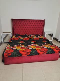 cushion bed with 2 side tables.