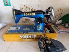 Sewing machine with electric motor