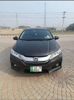 Honda Grace Hybrid 2014 model better than corolla Gli, Xli