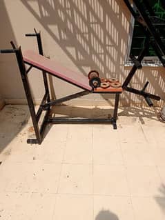 gym bench and dumbbell