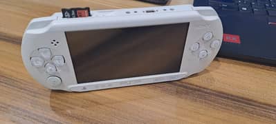 PSP Street (non wifi) with original charger and multiple games