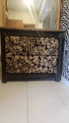 Elegant Dark Wood Table with Hand-Carved Floral Designs