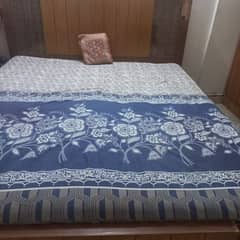 king size wooden bed with mattress