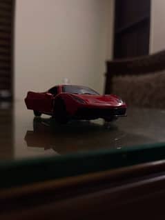 Red Ferrari/ small car model/ Dinki car/ Kind of Hot Wheels.