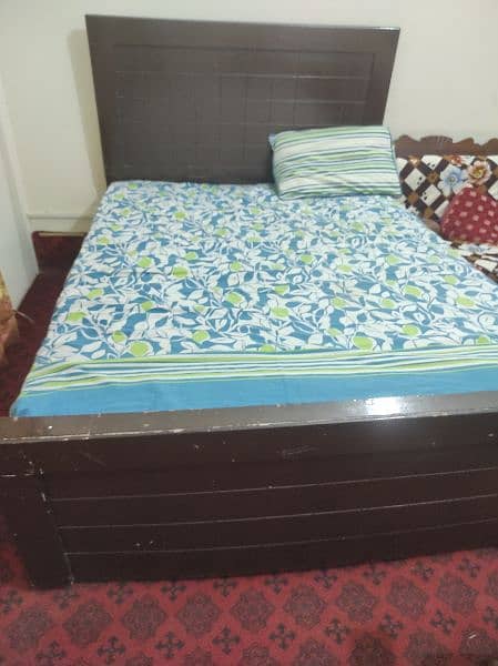 excellent condition double bed . chocolate wooden polish. 2