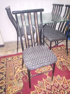 4 seater iron dining table for sale, in good condition.
