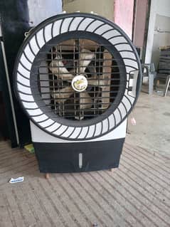 Air cooler with rotating fans