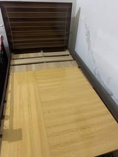 single wooden bed