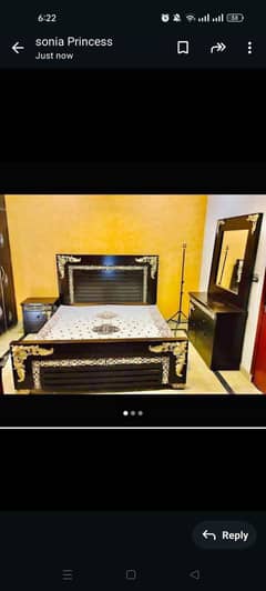 King size bed with cupboard side table. .