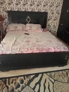 Black Wooden Bed and Wardrobe