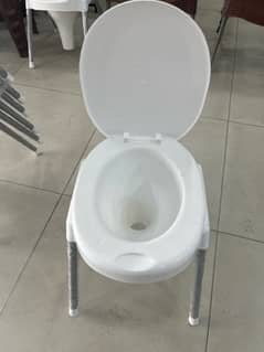 white plastic commode stool