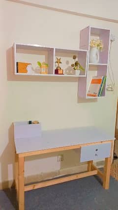 Study table with book shelf and chairs