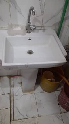 Wash basin with tap