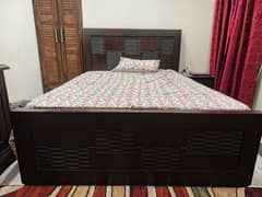 Small double size wooden bed