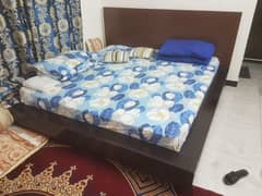 King size bed with side tables and mattress