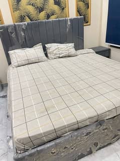 Bed with side tables and mattress