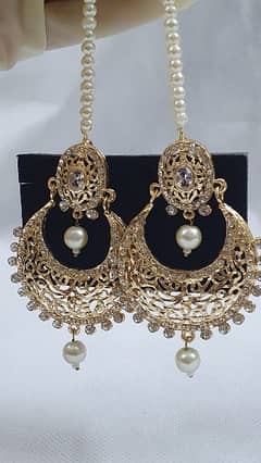 beautiful golden earning with beautiful pearls